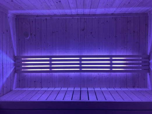 SaunaLife X7MOOD LED bar lighting a sauna in cool purple tones