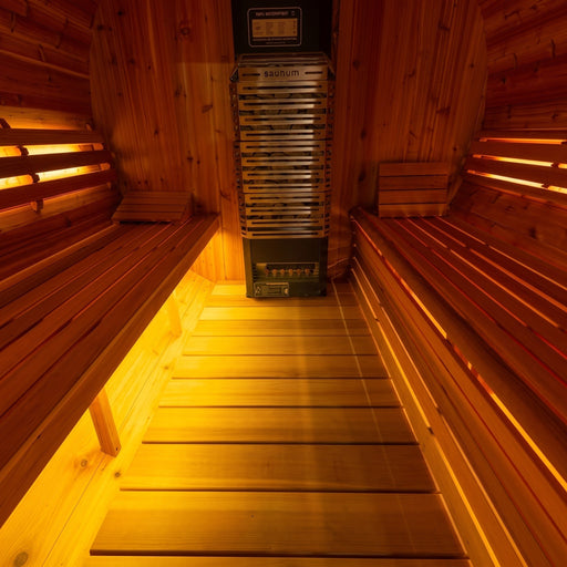 SaunaLumin Ambiance System lighting a cedar sauna interior with warm amber under-bench glow