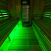 SaunaLumin double bench set lighting a cedar sauna interior in green RGB color
