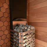 Saunum Air 5 heater tucked in a sauna corner with hexagon wood-tile accent wall