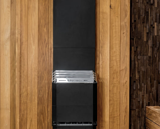 Saunum Air 5 black climate equalizer column mounted on a cedar plank sauna wall