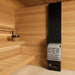 Saunum Air 5 heater and equalizer column installed beside light cedar sauna benches