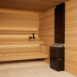 Saunum Air 5 heater in a light cedar sauna corner with black pail on the bench