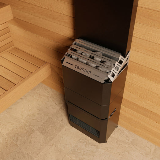 Top-down view of the Saunum Air 5 heater grille and stones against wood paneling
