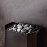 Close view of the Saunum Air Perfect heater top stone tray filled with stones