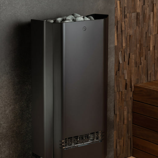 Saunum Air Perfect heater wall mounted beside wood paneling with stone tray