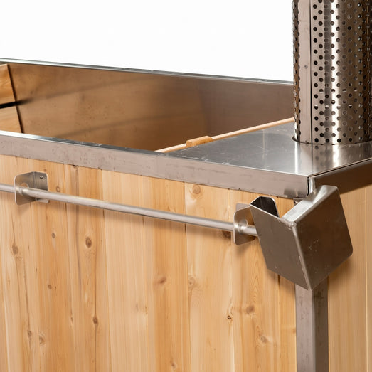 Dundalk Starlight wood burning hot tub corner detail with grab rail and stove pipe