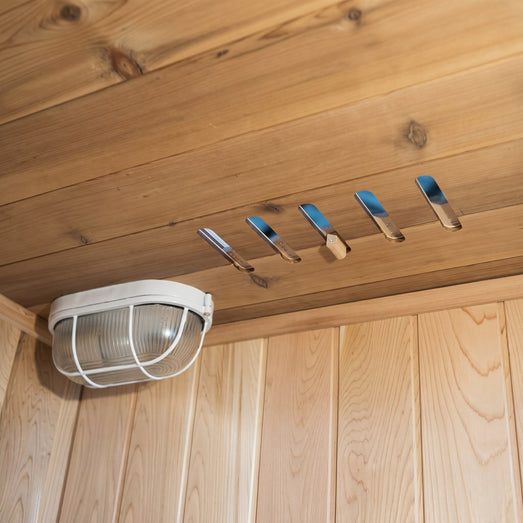 SunRay Aston 200TN ceiling light beside row of cedar towel hooks