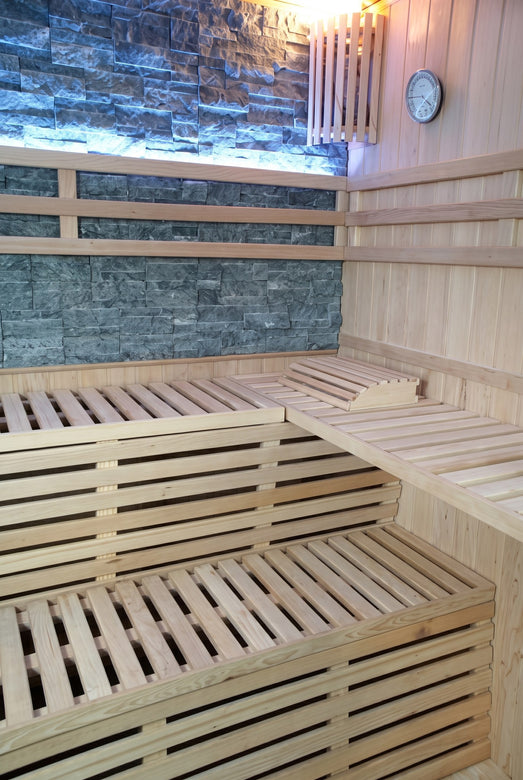 Inside the SunRay Galaxie: upper and lower benches and the slate-colored stone back wall