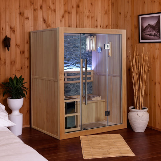 SunRay Rockledge 2-person indoor traditional sauna, angled view, in a room with wood-paneled walls