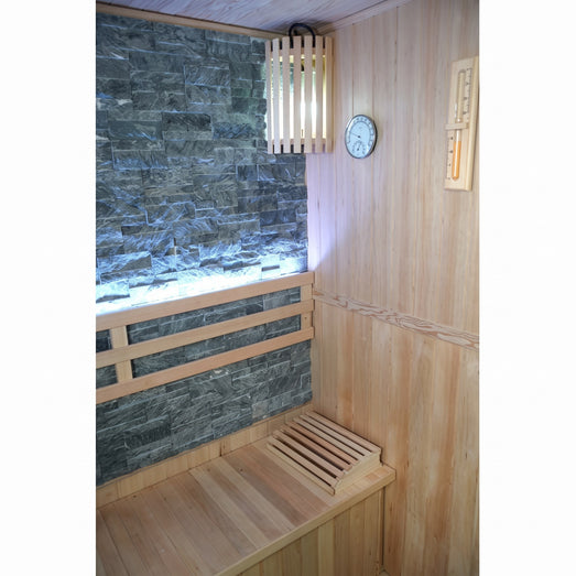 Corner of the SunRay Rockledge sauna with slatted lamp, thermometer-hygrometer, sand timer and lit backrest