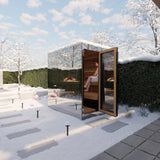 ThermaSol Vue mirrored sauna cabin in a snowy garden with the door open
