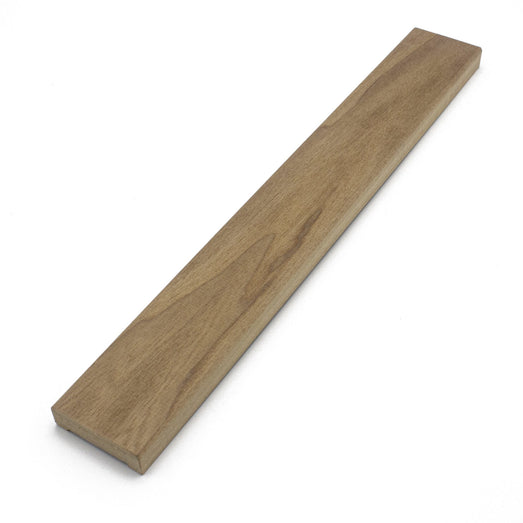Thermo-Aspen 1x2 Door Trim piece lying at a diagonal, showing the face grain and slightly rounded edges