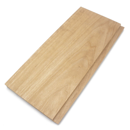 Thermo-Aspen 1x5 tongue-and-groove paneling board, angled top view showing light face grain and stepped edge