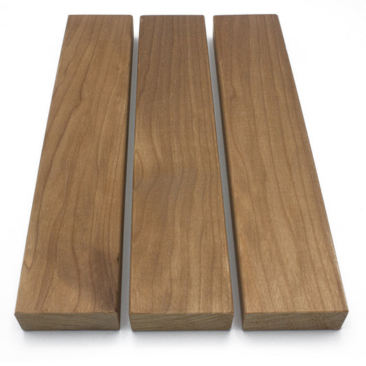 Three Thermo-Aspen 2x3 bench boards laid side by side, top-down view of the face grain