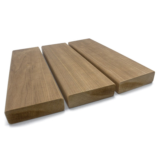 Three Thermo-Aspen 2x4 bench boards side by side, angled view showing face grain and end profiles