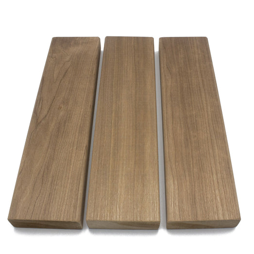 Three Thermo-Aspen 2x4 bench boards laid parallel from above, showing varied face grain and tone