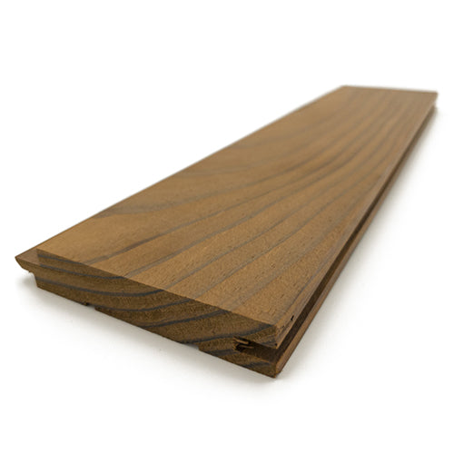 Thermo-Radiata Pine 1x4 tongue-and-groove paneling board, angled view of face grain and profiled end