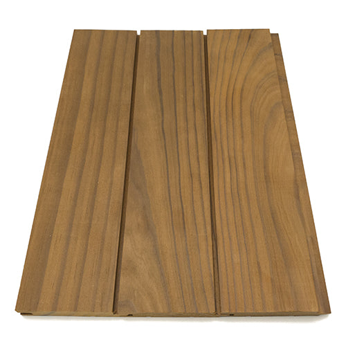 Thermo-Radiata Pine 1x4 paneling, top-down view of three boards joined edge to edge with grooved seams and varied grain