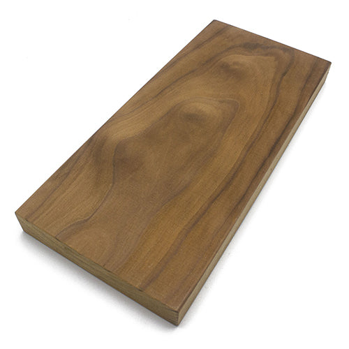 Thermo-Radiata Pine 2x6 bench board, angled view of the face grain with a figured knot and a visible edge