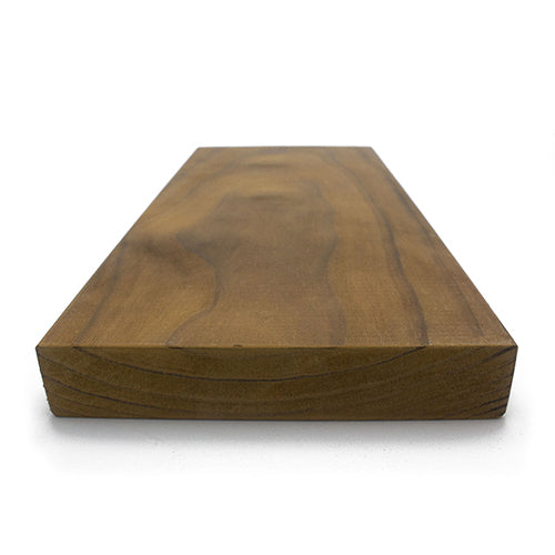 Thermo-Radiata Pine 2x6 bench board, low end view showing the dark brown face grain and the thick end grain