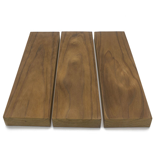 Three Thermo-Radiata Pine 2x6 bench boards in a row, viewed from above with varied brown grain and knots