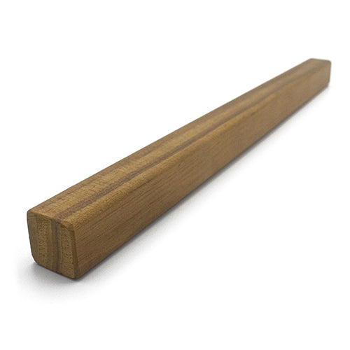 Thermo-Radiata Pine 1x1 Trim piece in an angled view, showing the square end and long face grain in warm brown tones