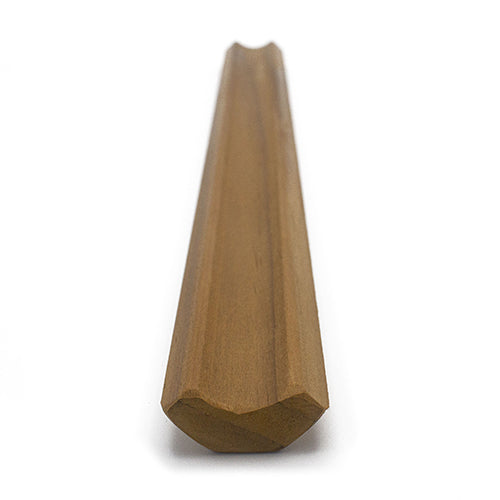 Thermo-Radiata Pine 1x2 Inside Corner Trim piece, end view showing the angled profile and hollowed channel