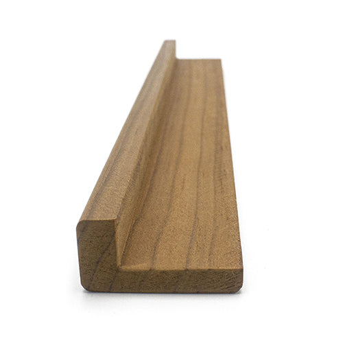 Thermo-Radiata Pine 1x2 Outside Corner Trim piece, end view showing the L-shaped cross-section profile